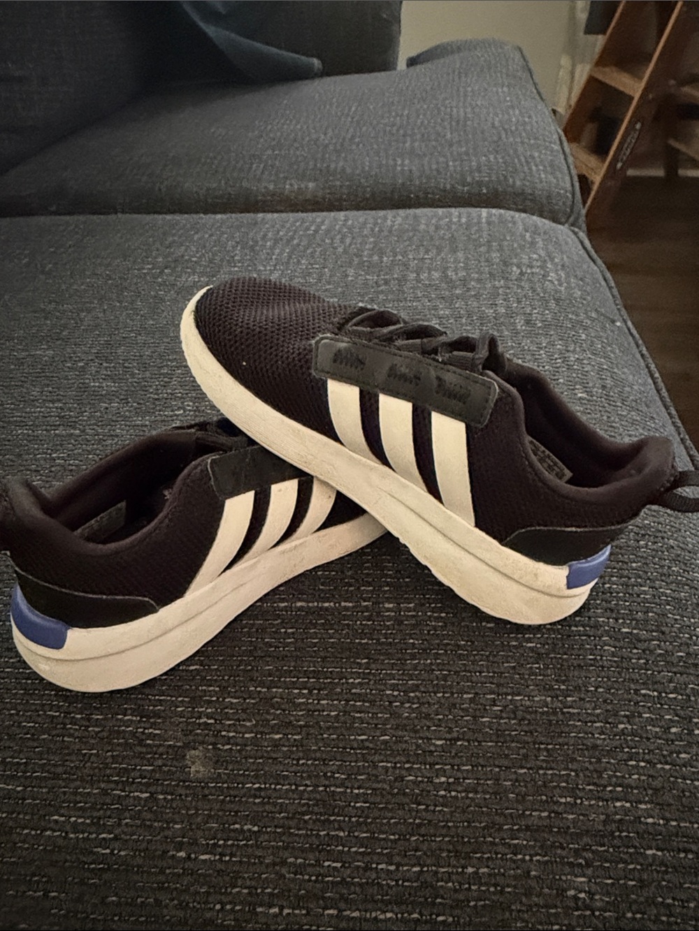 adidas Black Sneakers with White Stripes and Blue Heel Accent